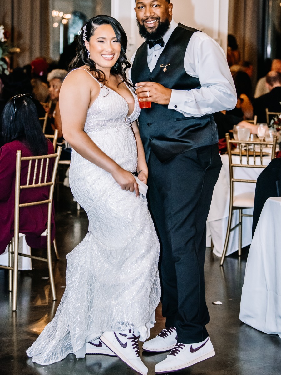 bride and groom wear matching Jordan sneakers at wedding