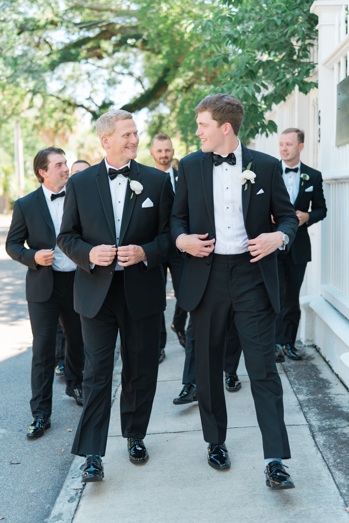 Groom and his men in black tuxedos