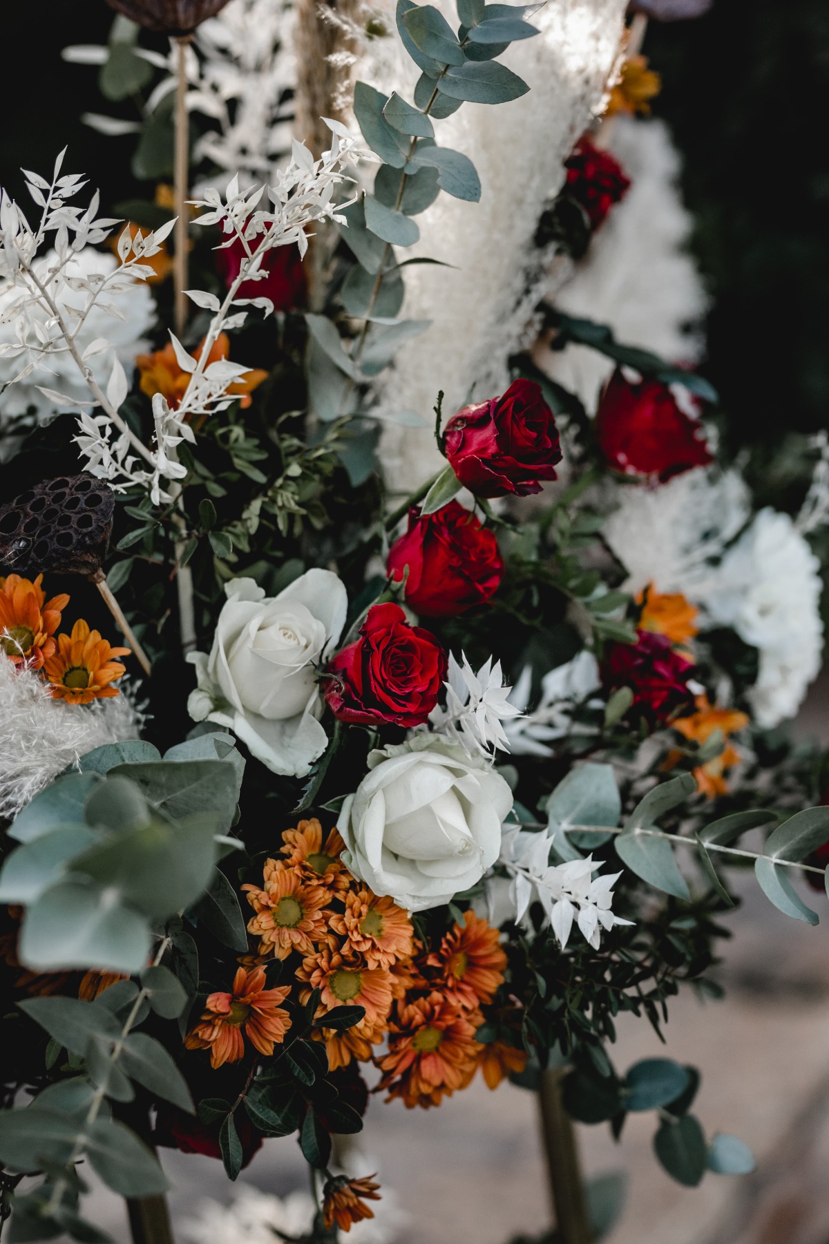 red and orange wedding arrangements