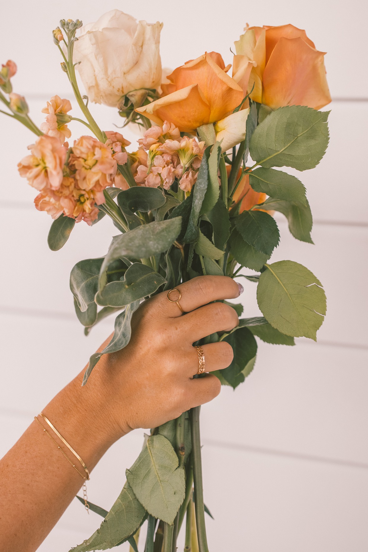 bridesmaid wearing rings and bracelets from Made by Mary