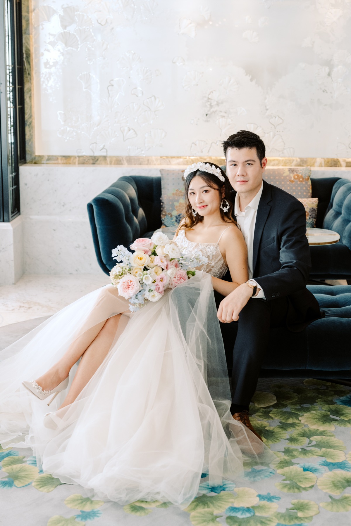 bride and groom pose in chic Parisian venue