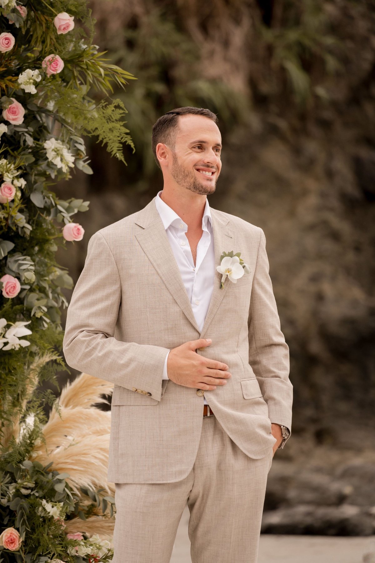 groom in linen suit for beach wedding