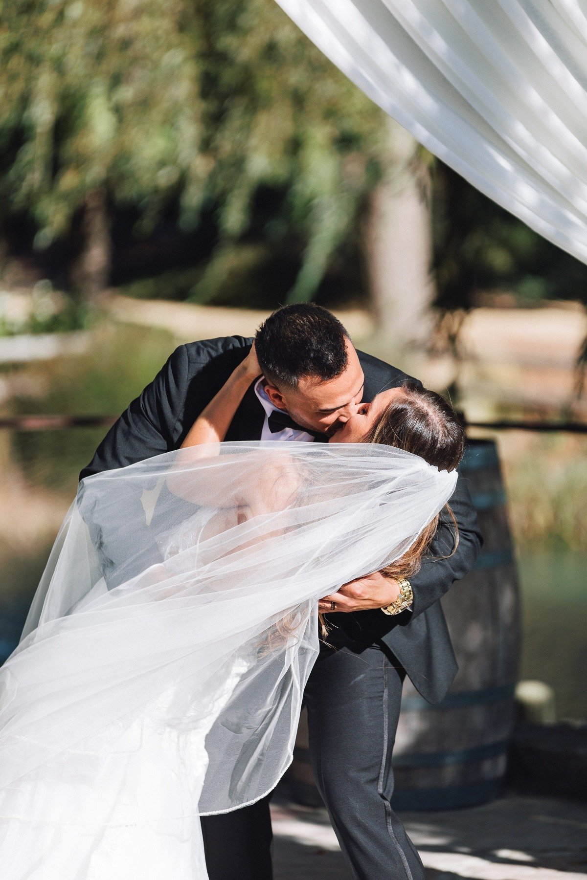 bride and groom kiss ceremony 