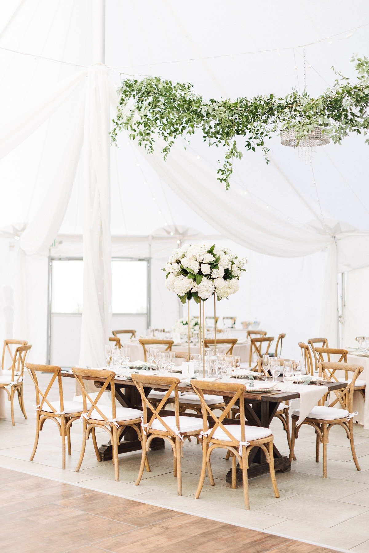 tent wedding with hanging vine floral installations