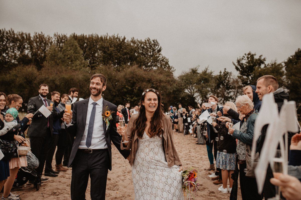 Wedding couple is celebrated after the wedding Ceremony on the beach 