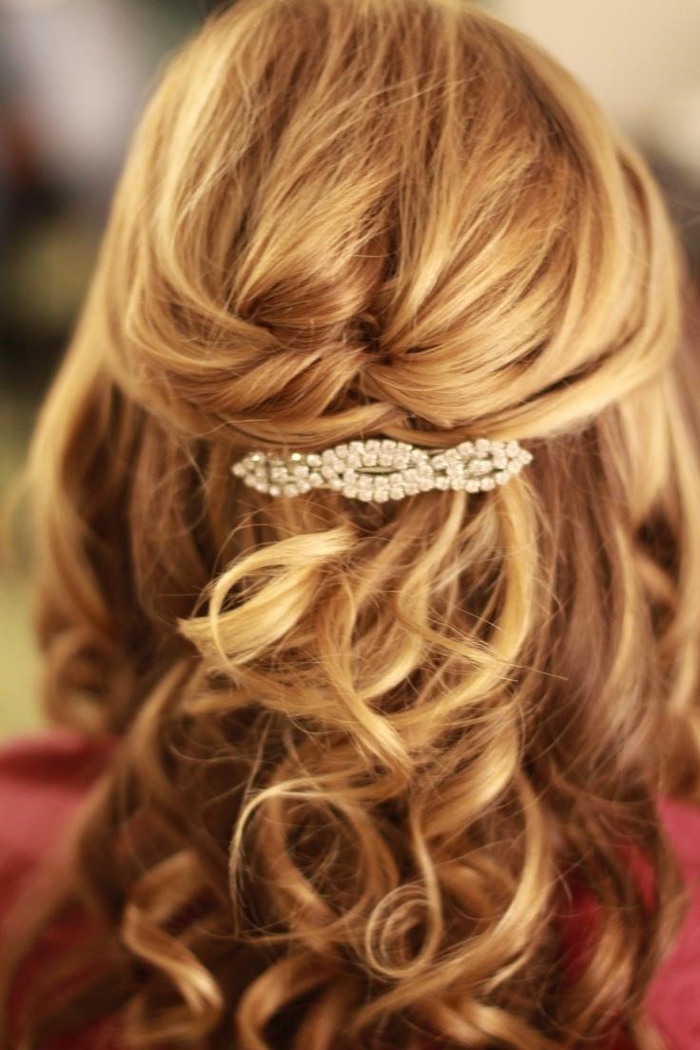 blonde hair with a hair clip made of glass beads curly hair wedding hair in