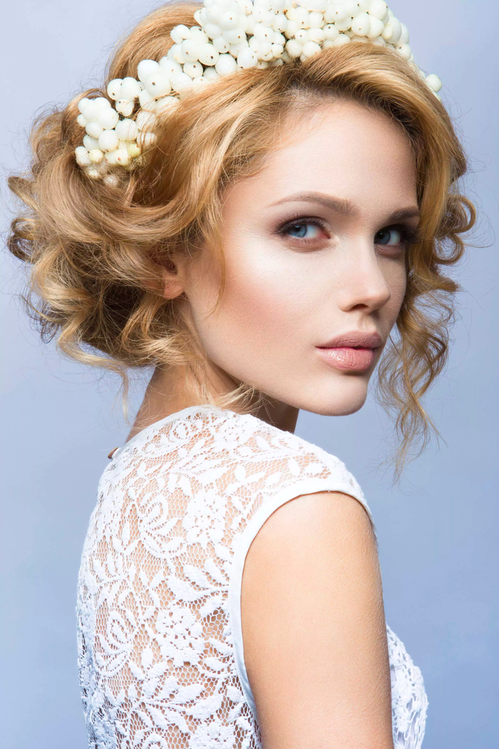 simple wedding hairstyles white tiara made of flowers curled hair, blonde hair 