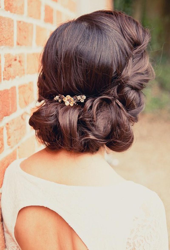 Hairstyle with a rounded shape and a small jewelry as an accent - wedding hair