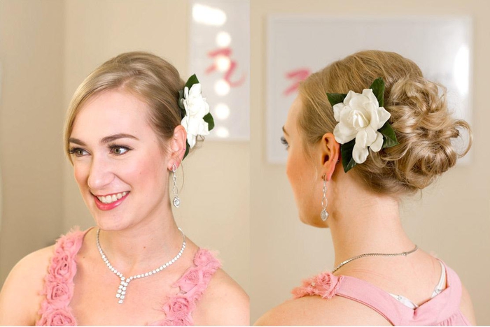 simple and fast hairstyle for a wedding with a white flower, pink dress