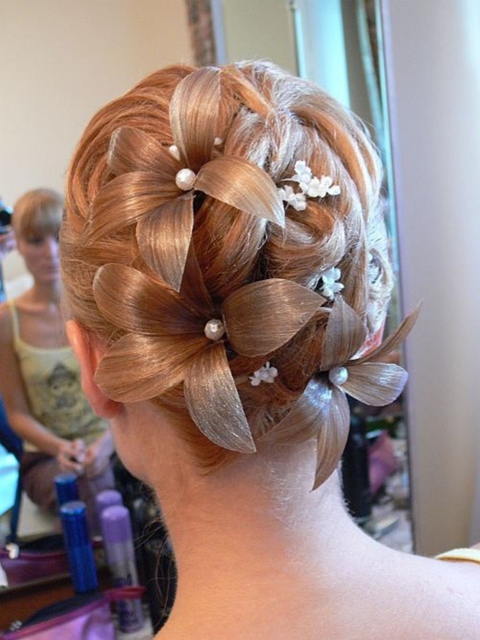 a fancy wedding hairstyle with flowers in the color of the hair