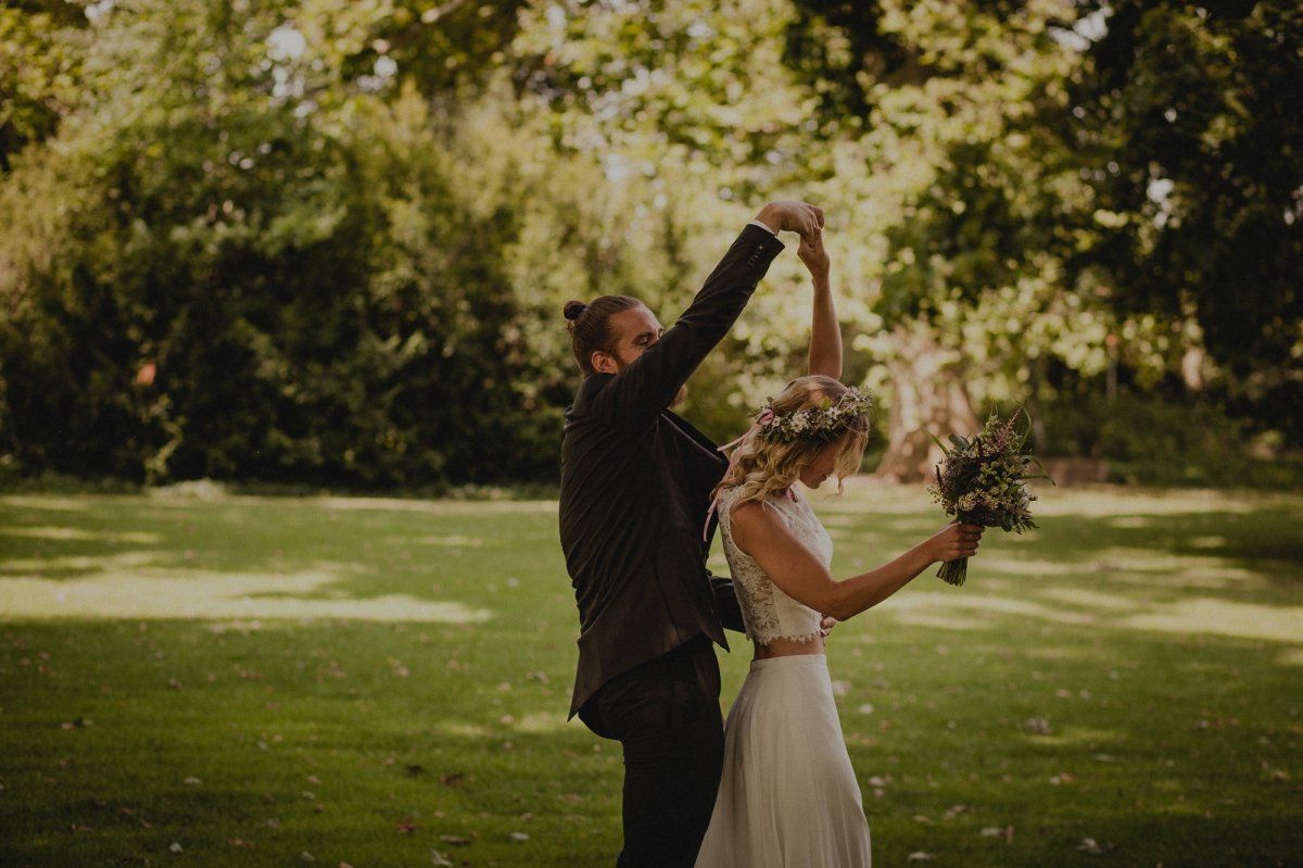 Wedding couple dancing a wedding dance in a Meadow