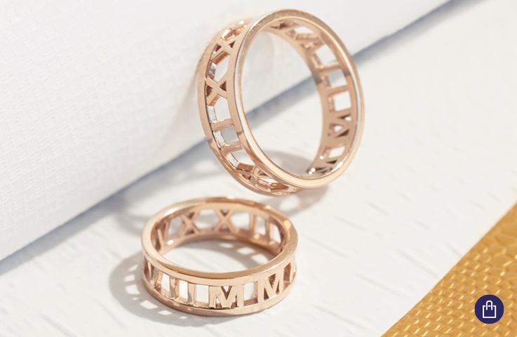 Golden wedding rings with original engraving on the circumference