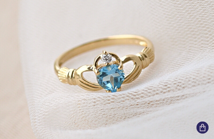 Golden Claddagh Ring with Topaz