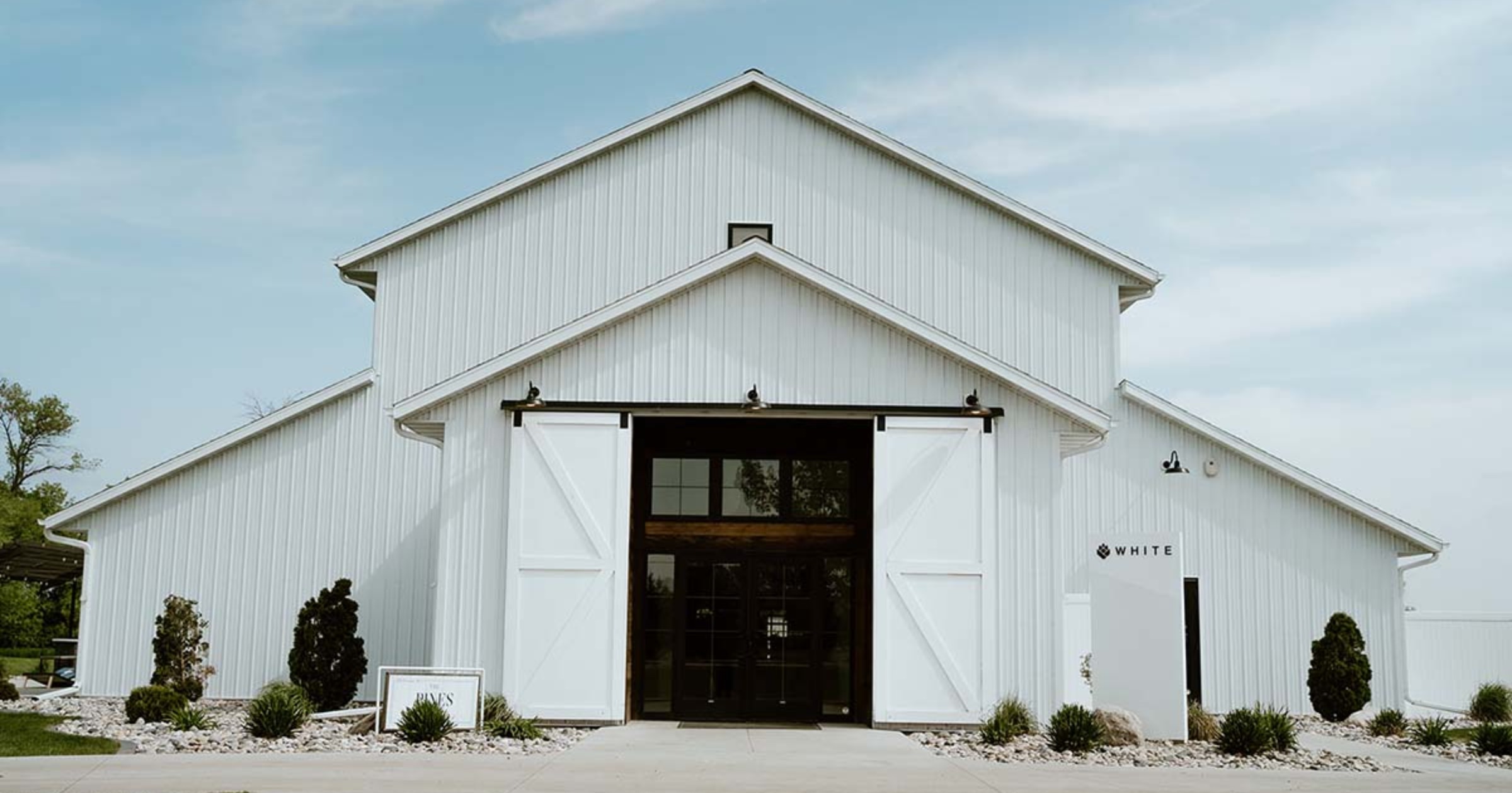 Pines White white barn wedding venue in North Dakota