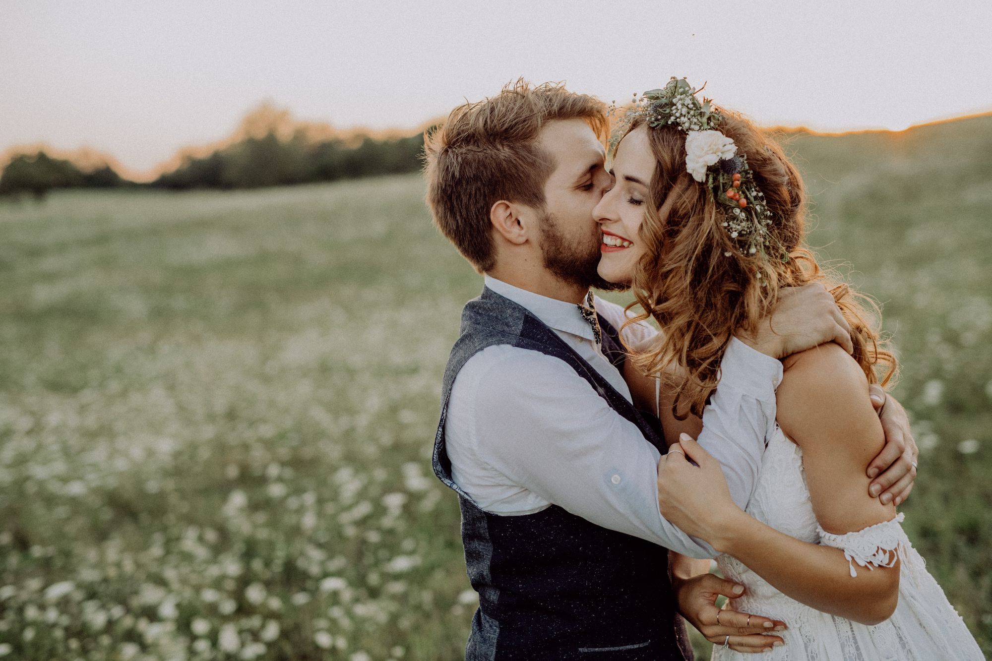 A bride and groom hugging on the Lawn