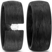 Wedding rings made of Carbon, optionally, with a large brilliant in the clamping ring optics