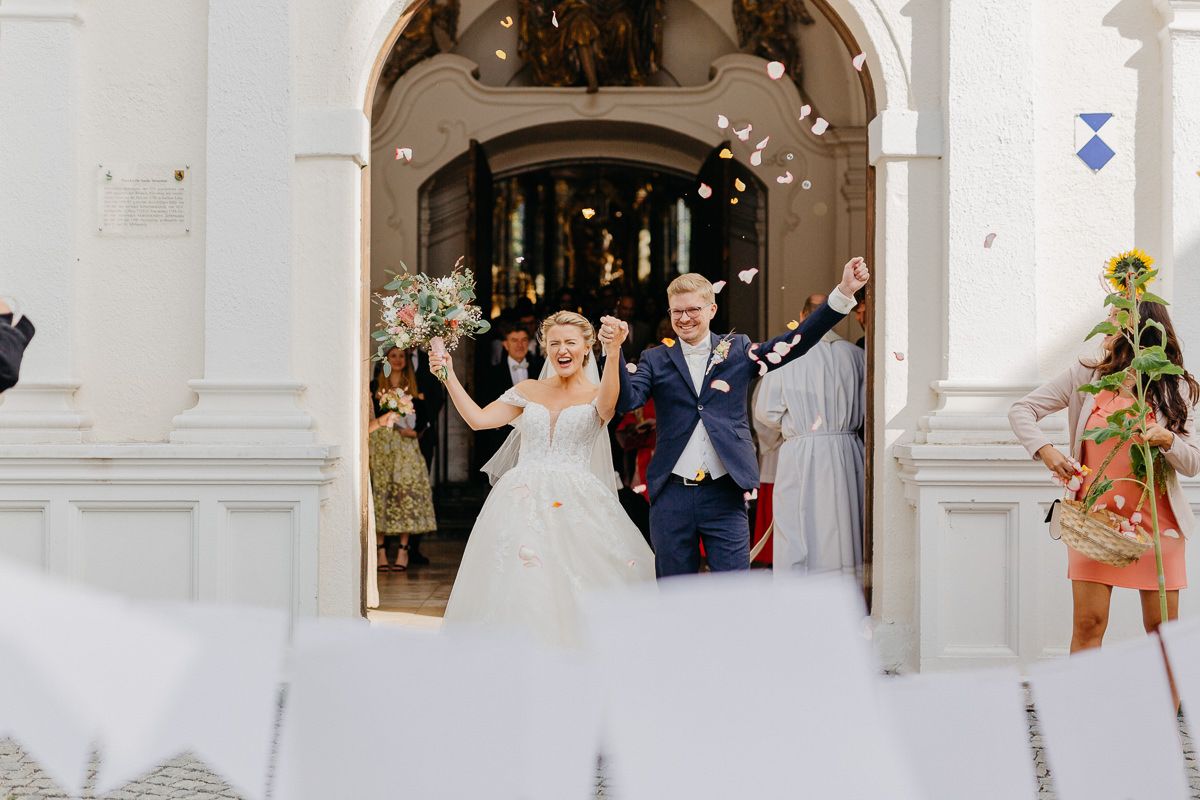 A Bridal pair comes in a jubilant celebration of the Church