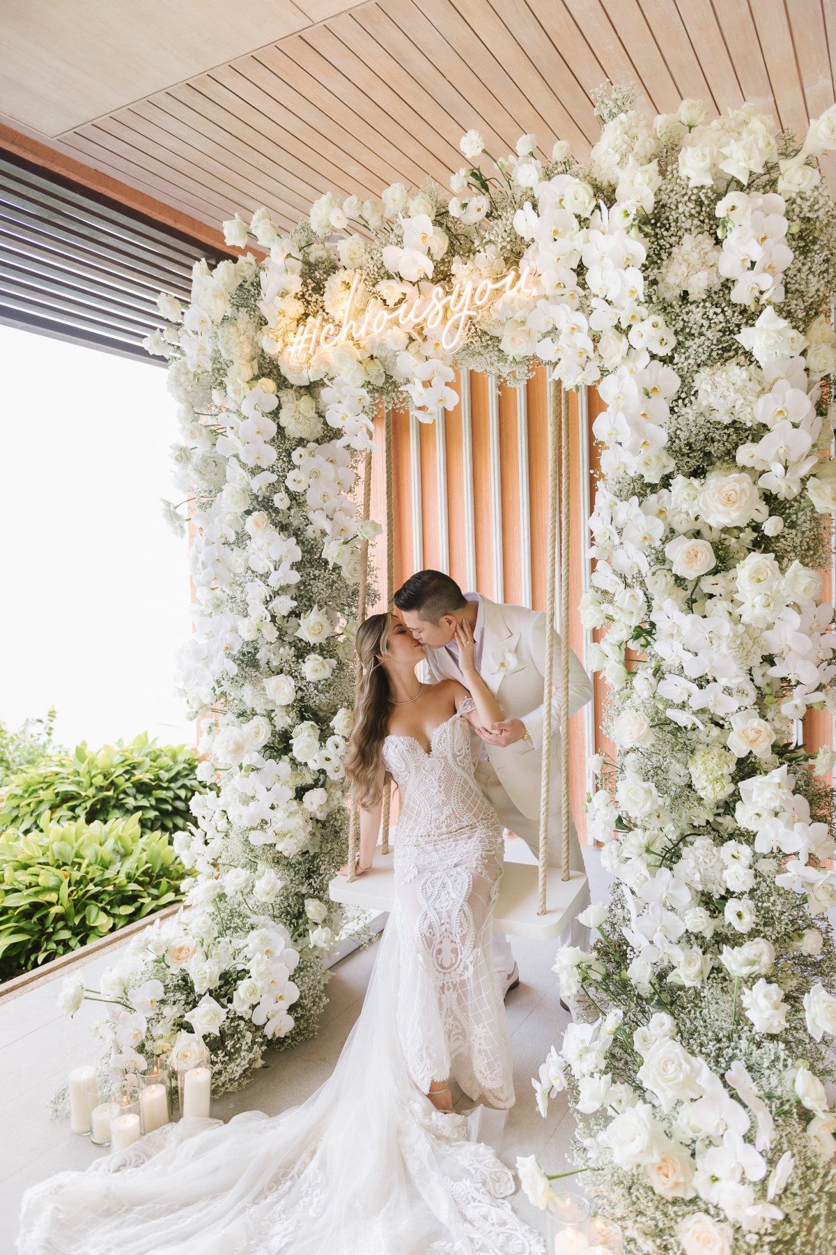 Romantic floral swing newlyweds