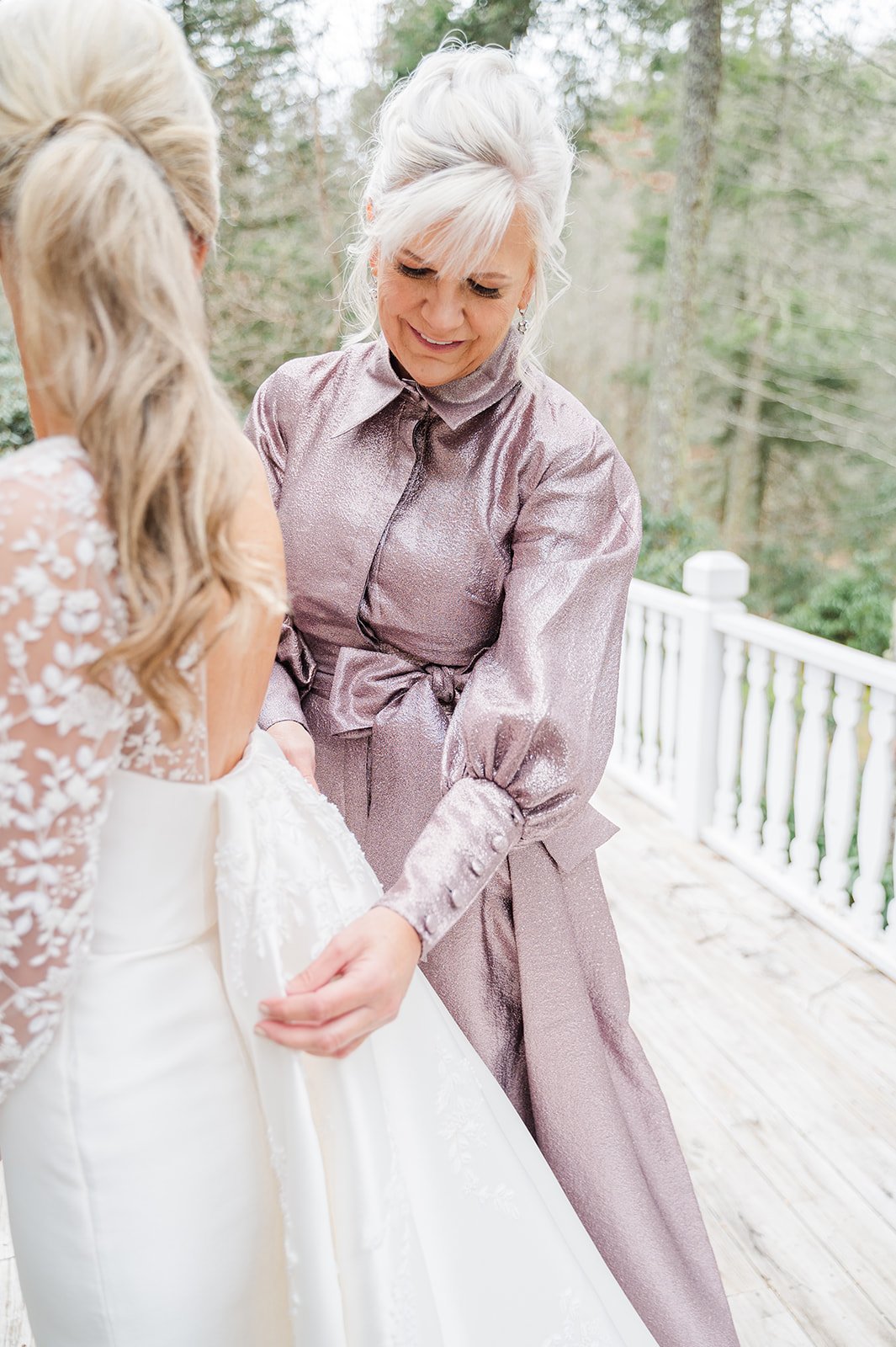 Southern mother of the bride helping her get dressed 