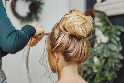 High bun with loose strands