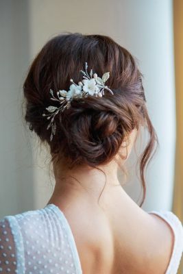 An elegant hair accessory completes the wedding hairstyle