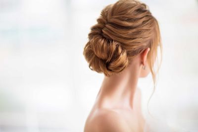 A deep-seated chignon as a wedding hair style always goes