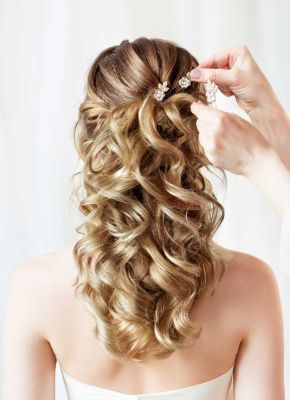 Curls are a lovely base for a wedding hairstyle