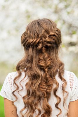 Semi-ambitious wedding hairstyle with herringbone braid