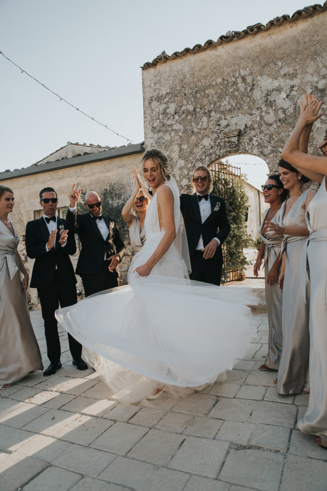 Bride dancing with a flowing dress