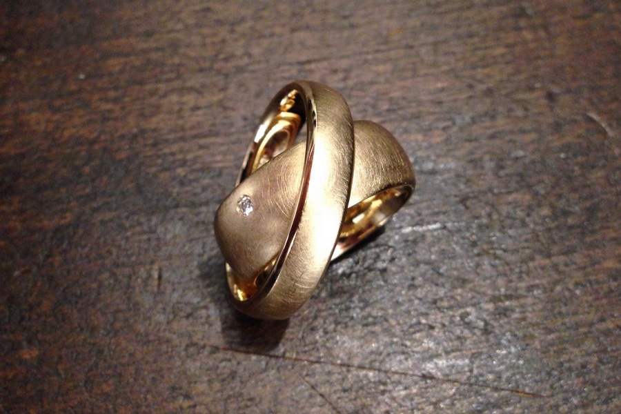 Wide wedding bands, wedding rings in Gold with a small Brilli of the goldsmiths Form and value in Nuremberg, Germany