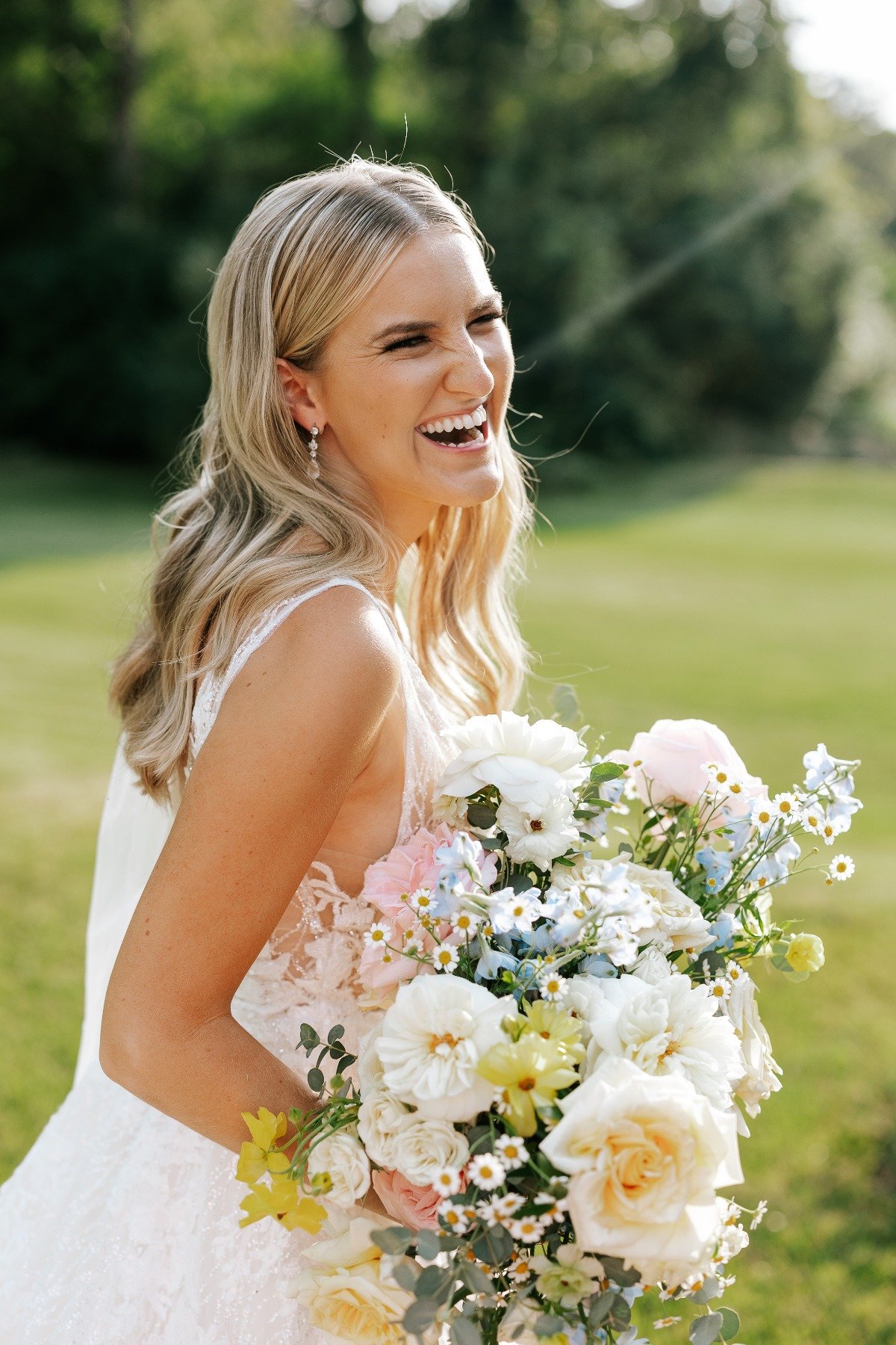 Spring blonde bride with bouquet