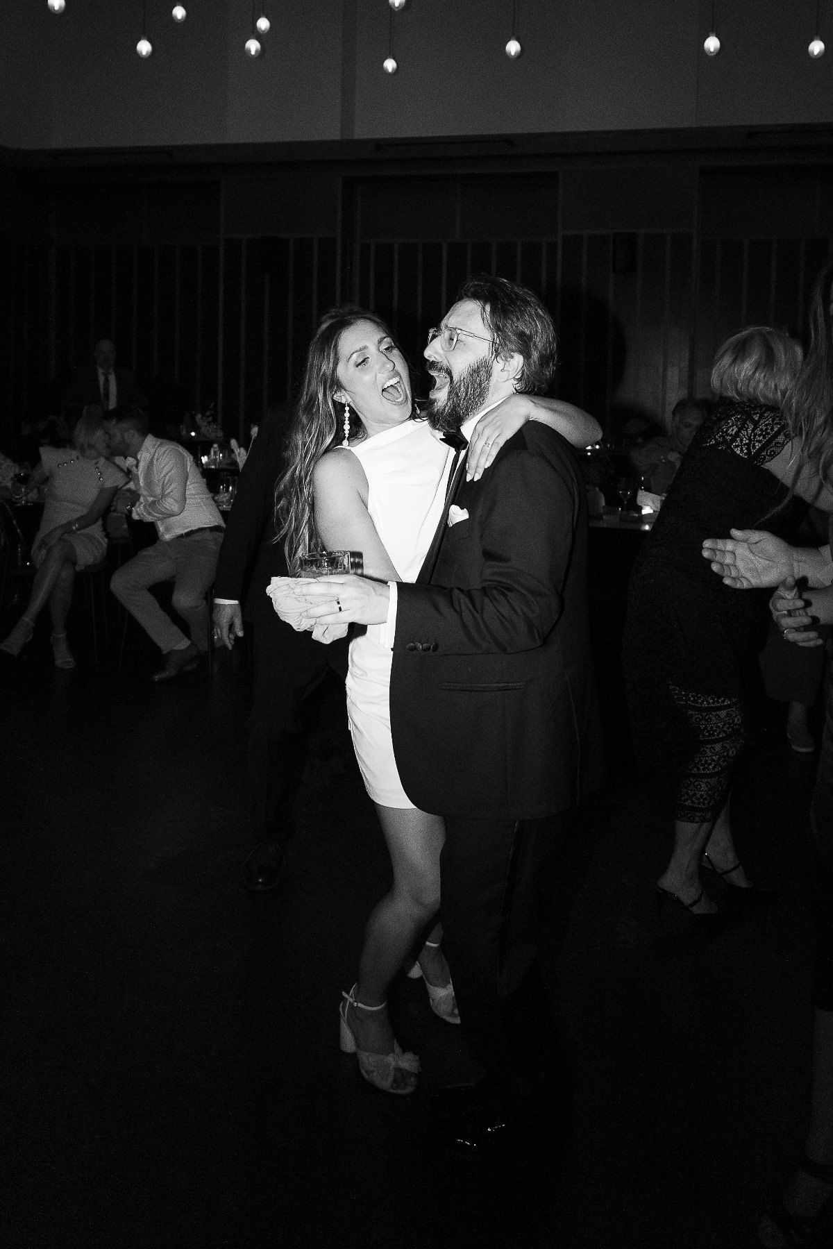 Bride and groom singing on the dance floor 