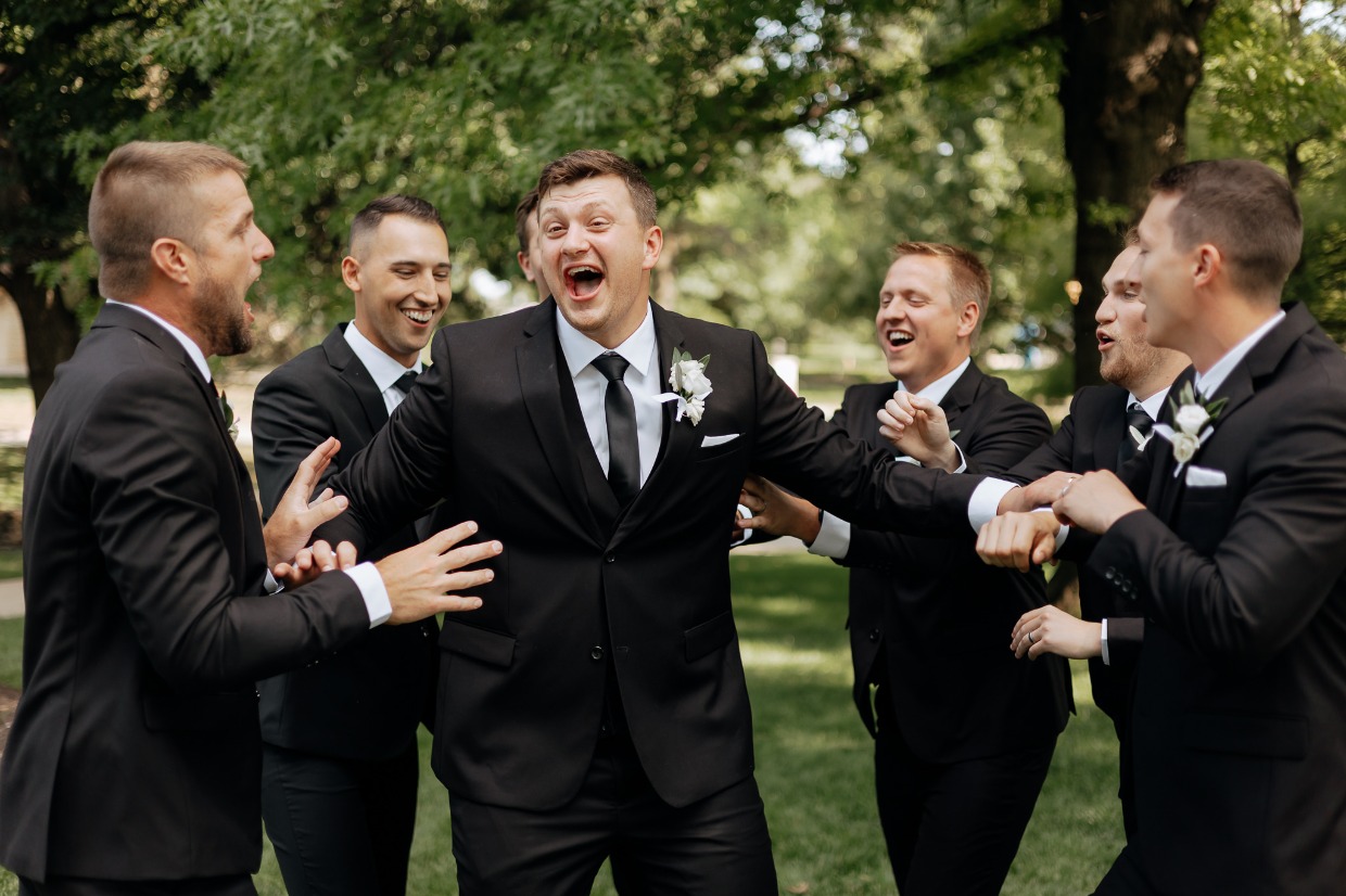 classic black wedding suit from the modern groom