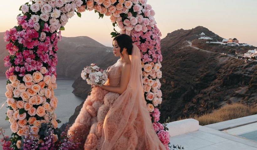 The bride’s couture pink gown was a vision of the Santorini sunset