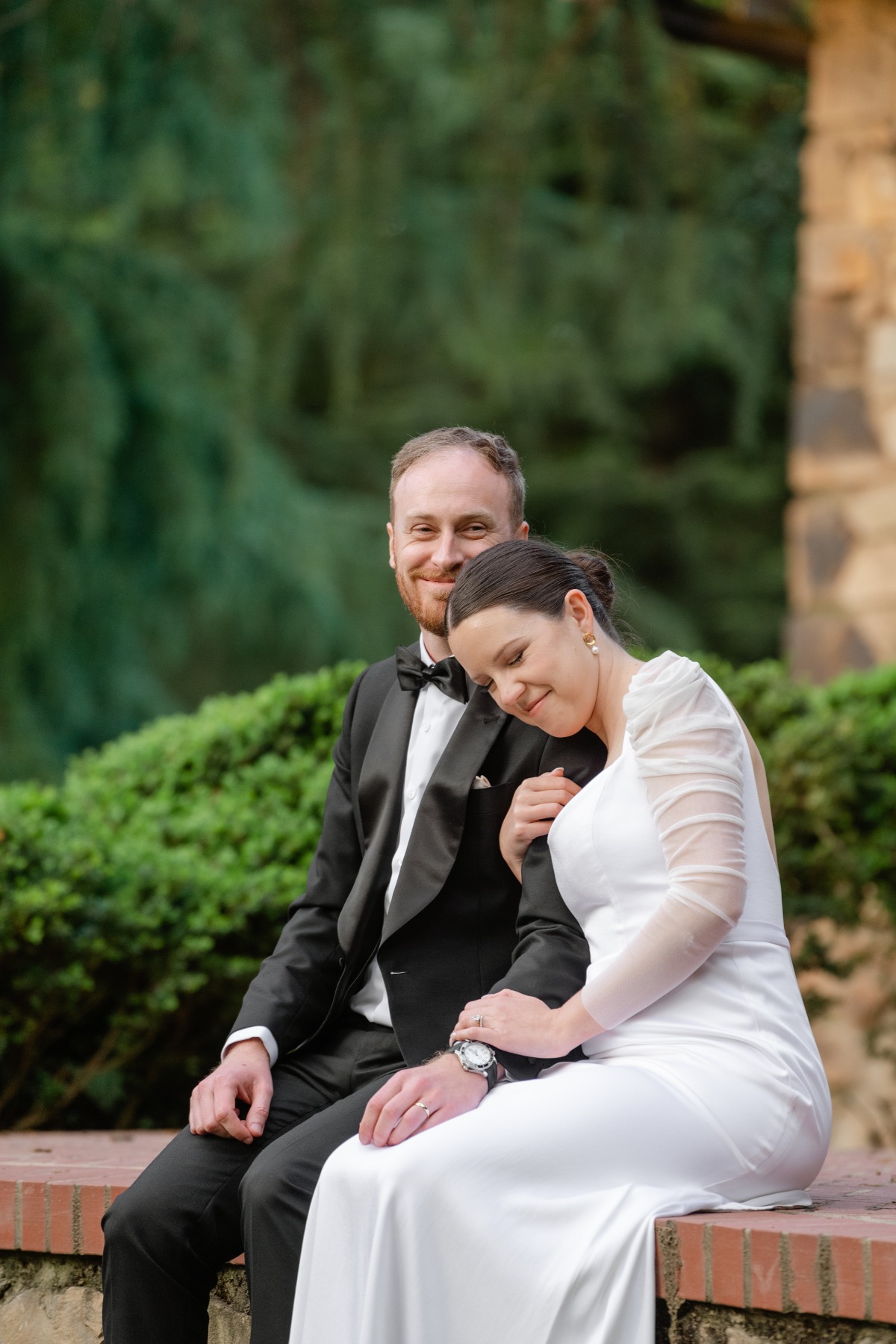 Bride and groom snuggling at VanLandingham Estate