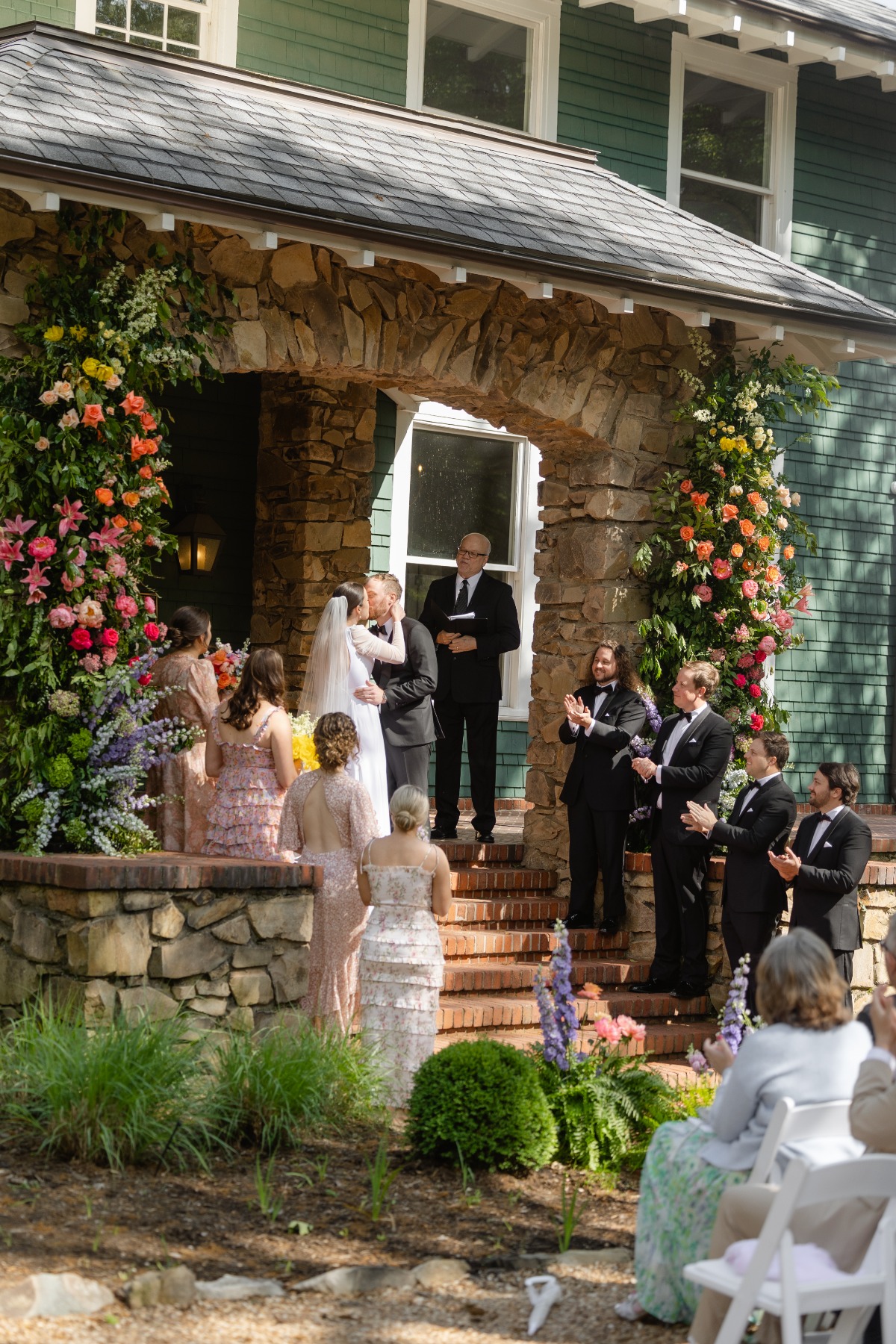 First kiss on estate ceremony steps 