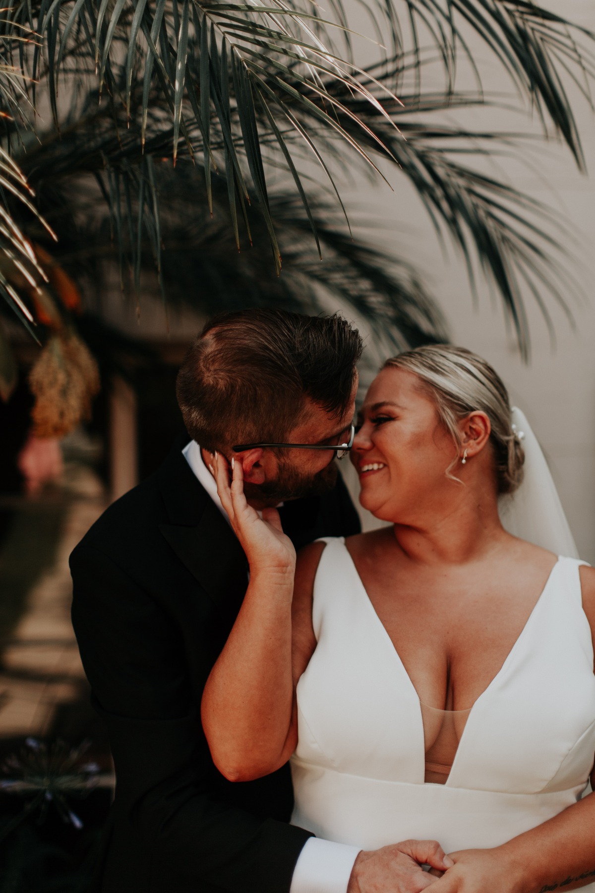 Romantic bride and groom with palm trees