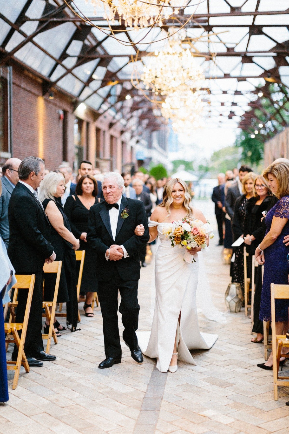 Timeless bride walking aisle 