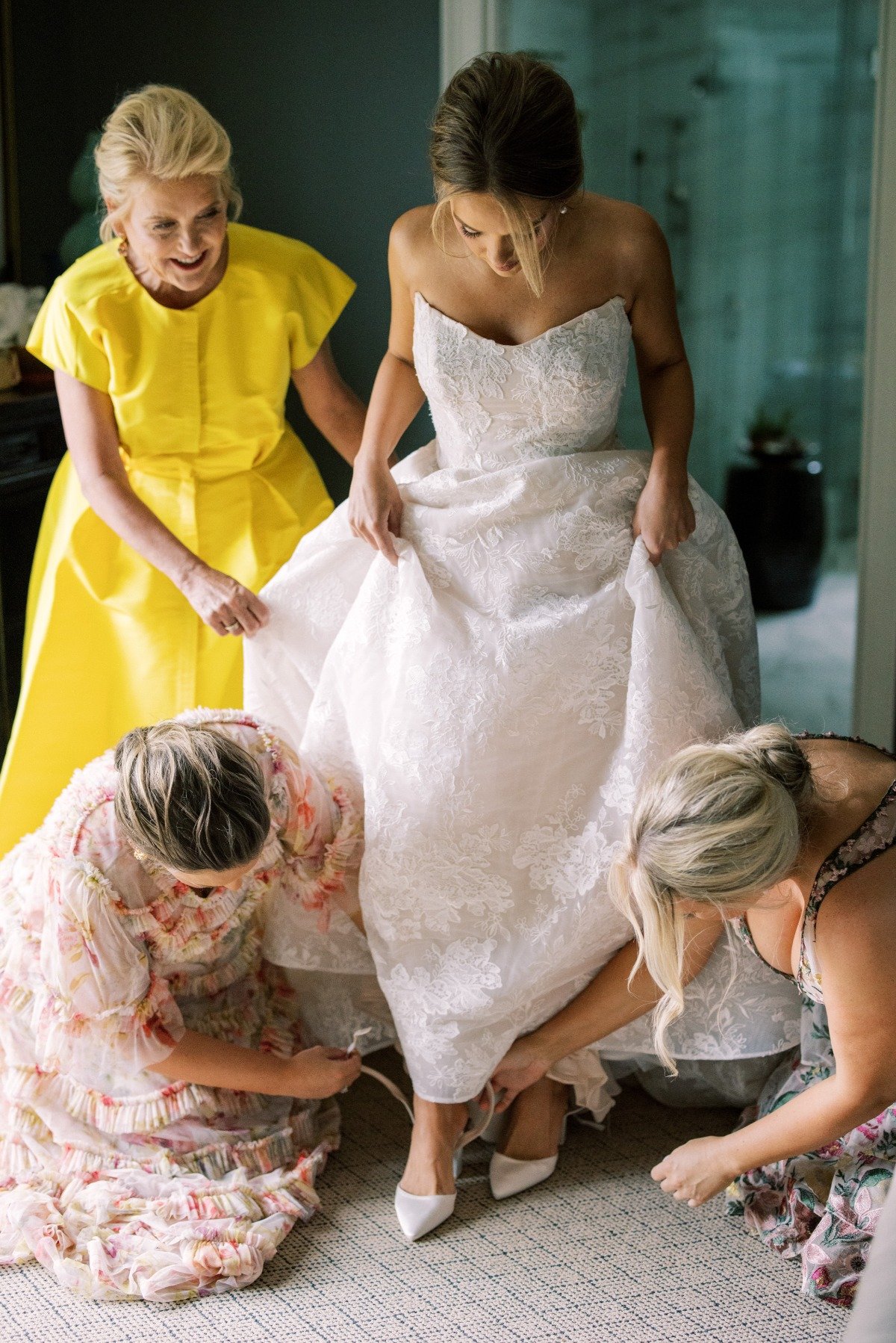 Bride putting on pointed wedding heels 