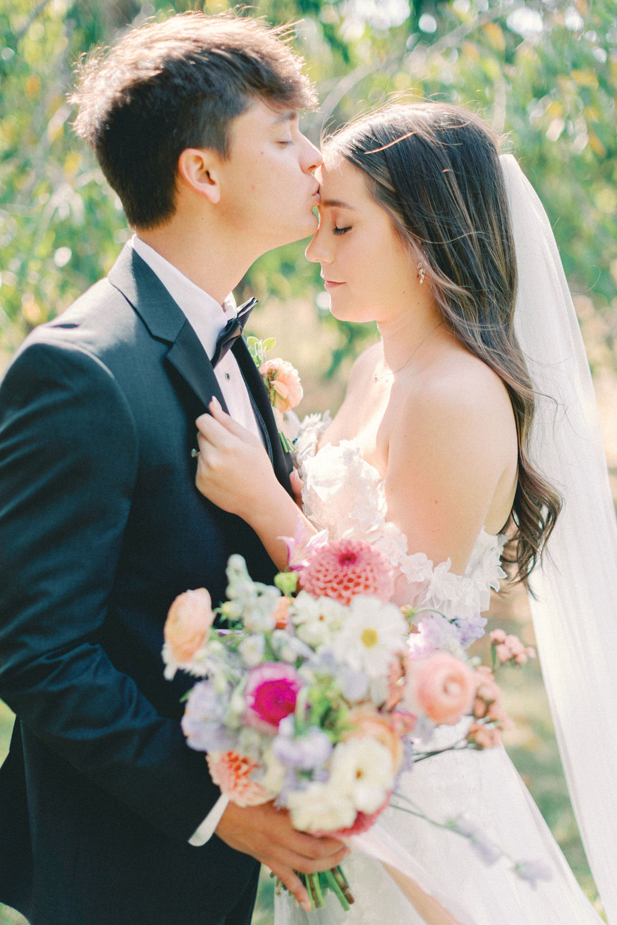 pink flowers ceremony backdrop with arches