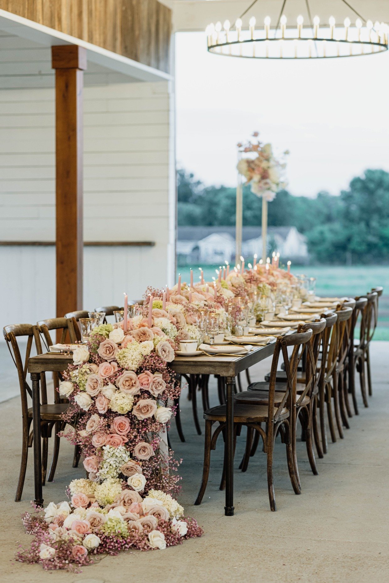 Bullbourne Ranch farm table and chairs inside barn