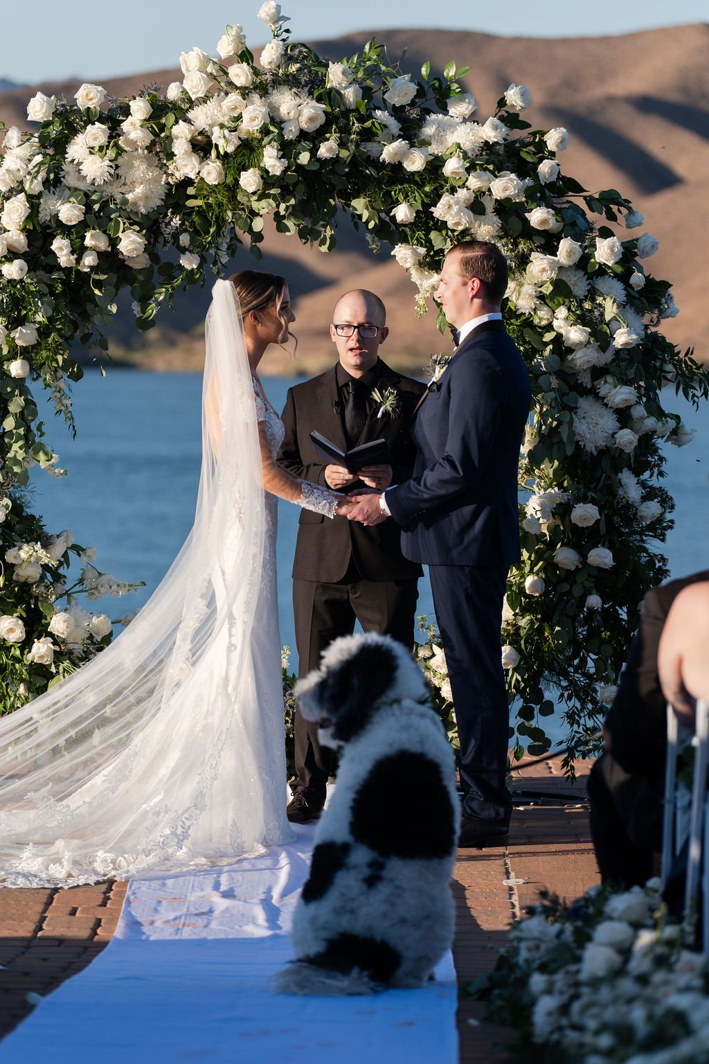 Havasu springs ceremony with big white rose floral arch