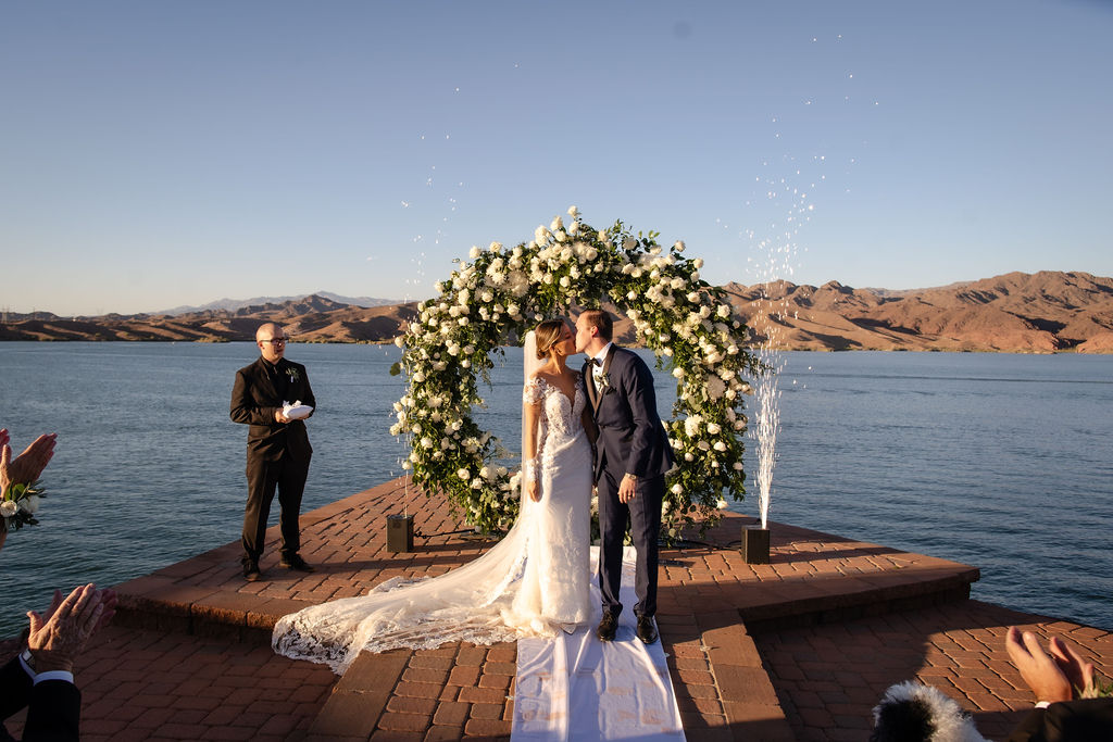 Havasu springs waterfront ceremony with floral arch