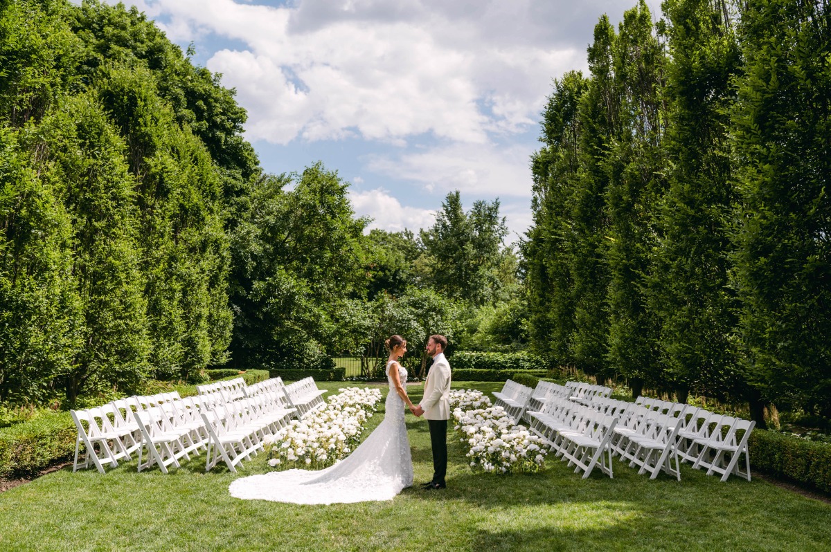 Chic white floral runway style wedding ceremony 