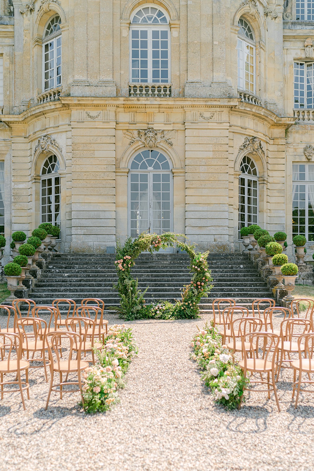 wedding ceremony arch mostly greenery