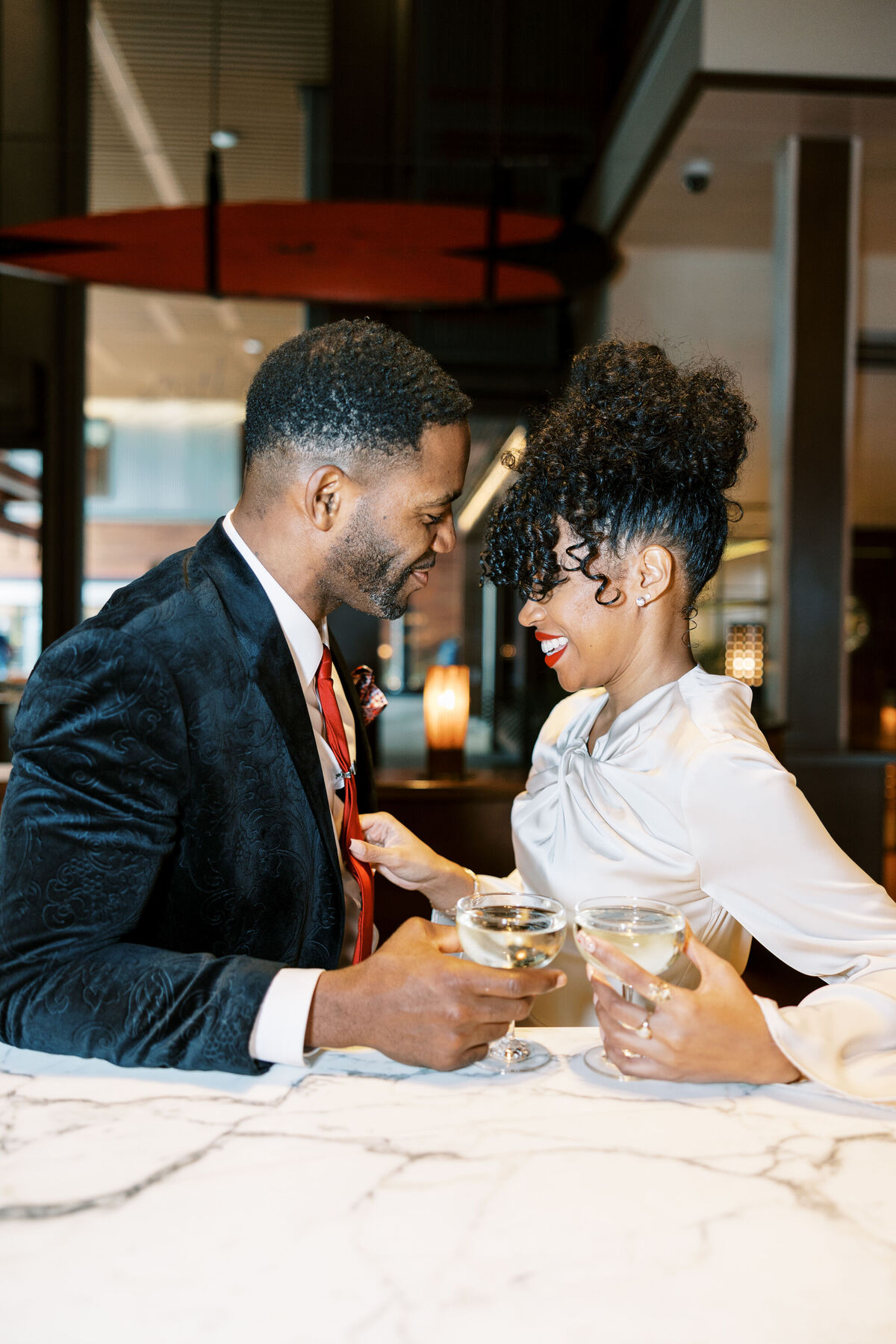 NYC bride and groom toasting cocktails 