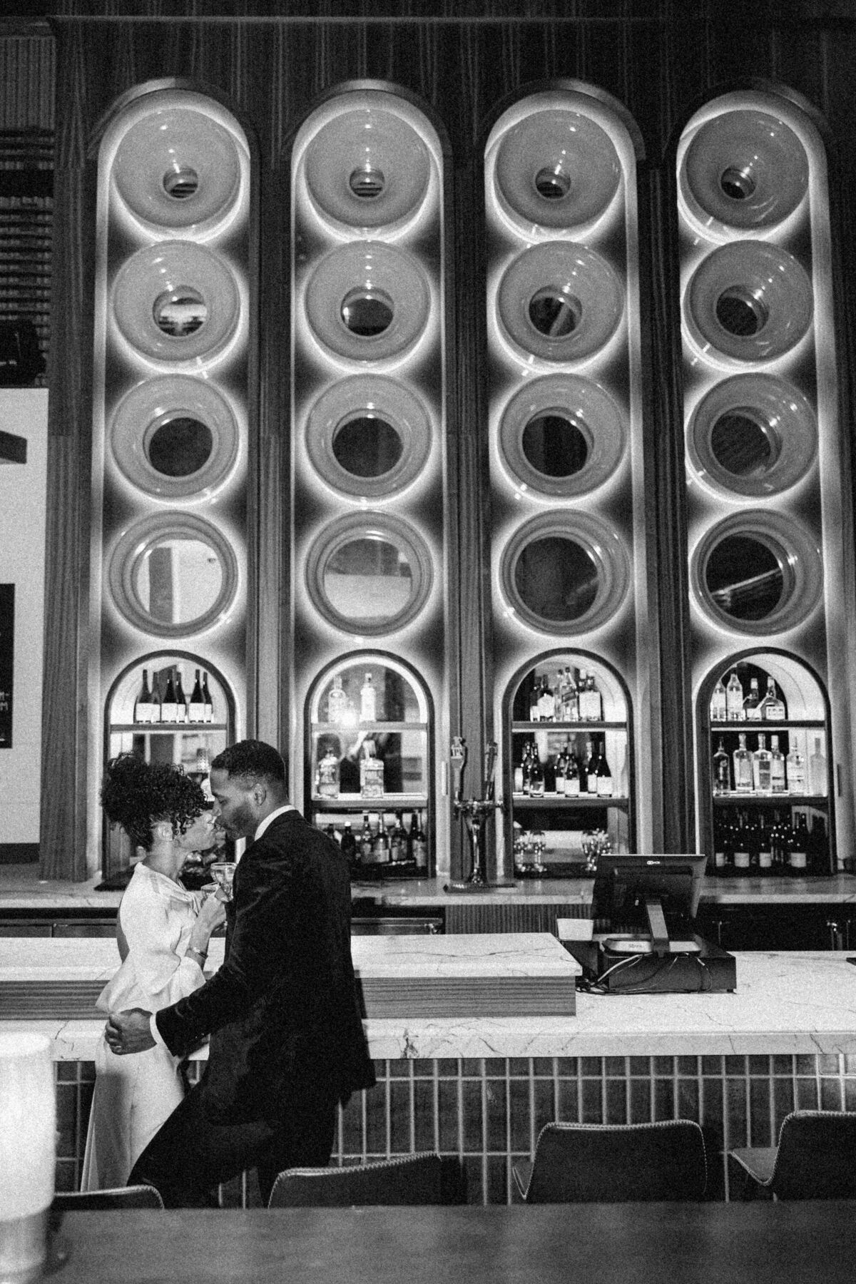 NYC couple at modern bar for reception 