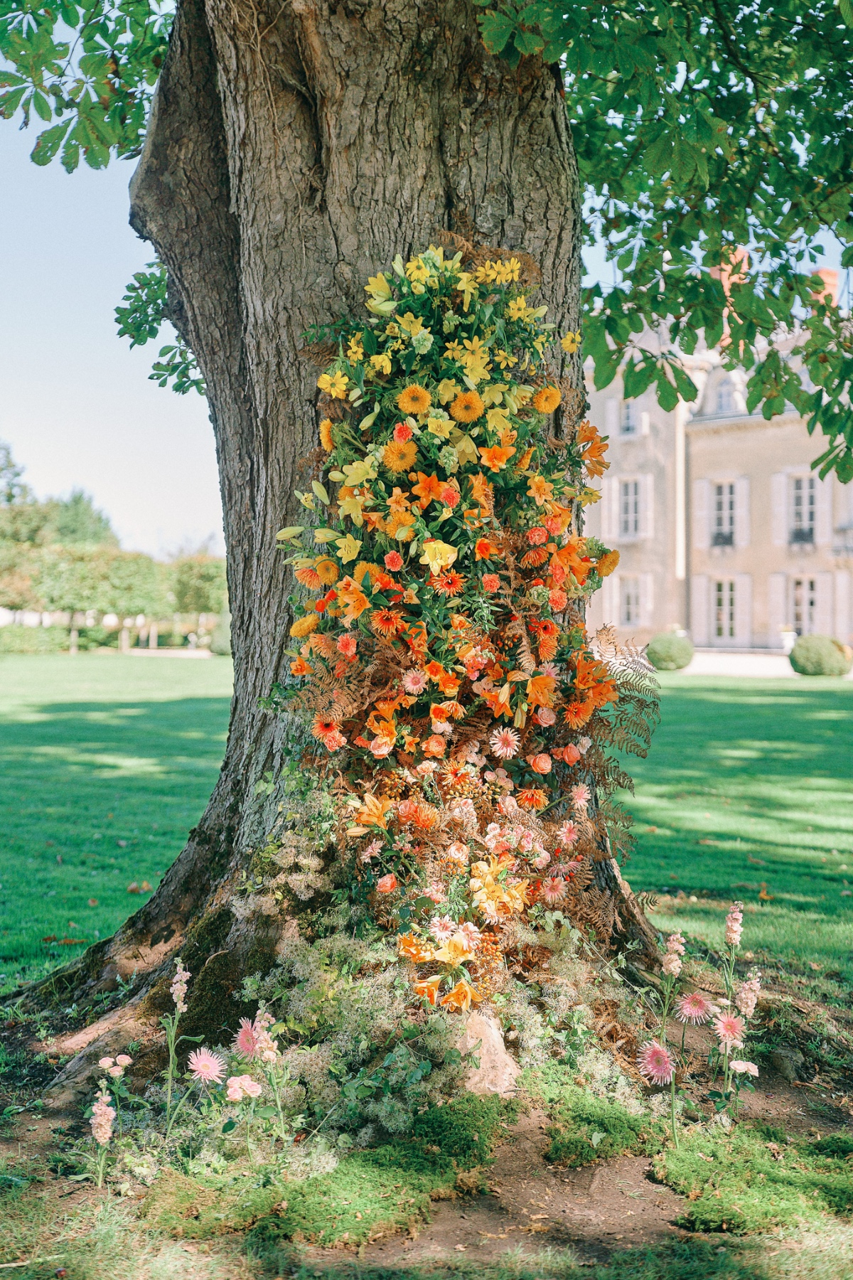 Rainbow floral backdrop for wedding ceremony