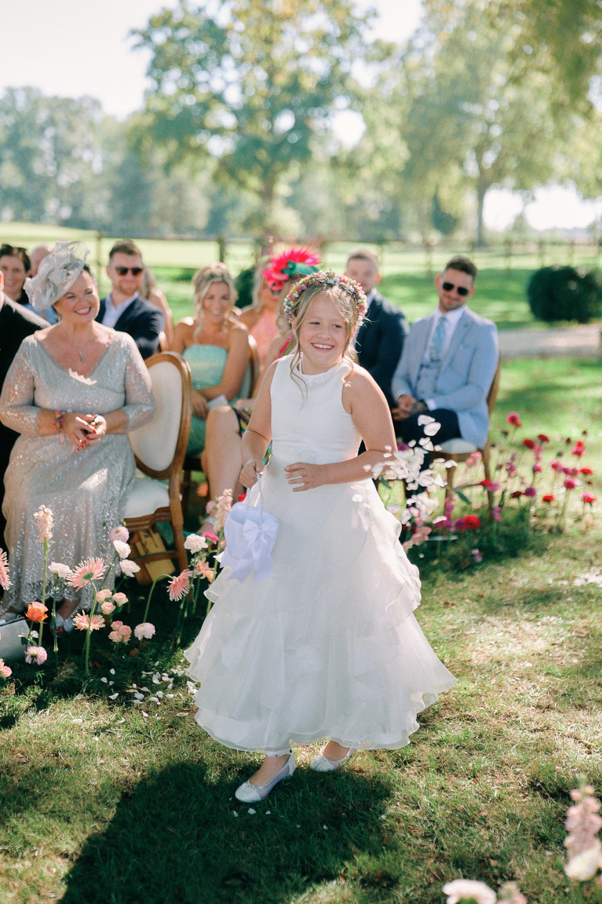 Elegant flower girl at French outdoor wedding 