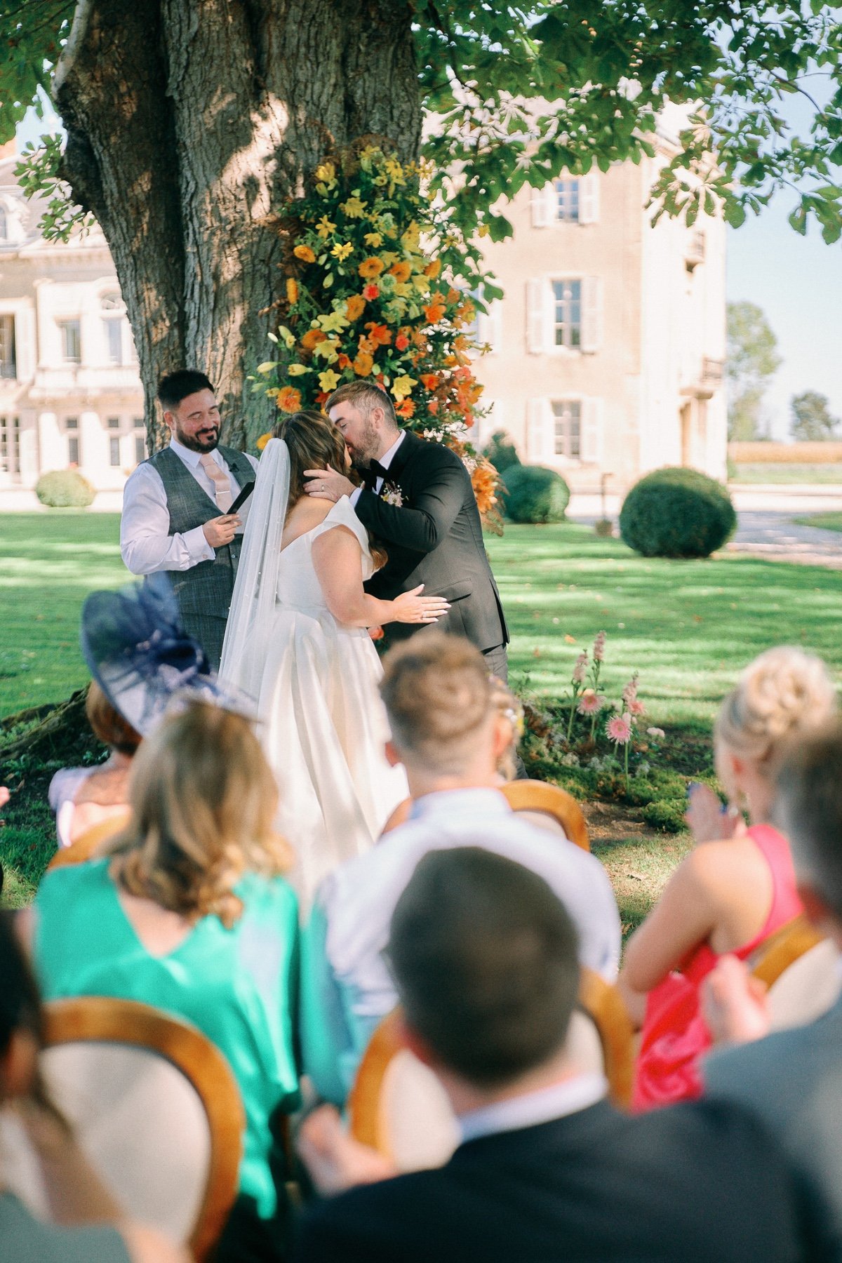 A sun-kissed French chateau wedding in hues of pastel rainbow